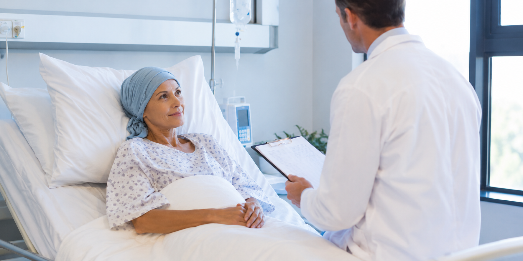 Doctor discussing chiropractic care with a cancer patient to help manage treatment side effects