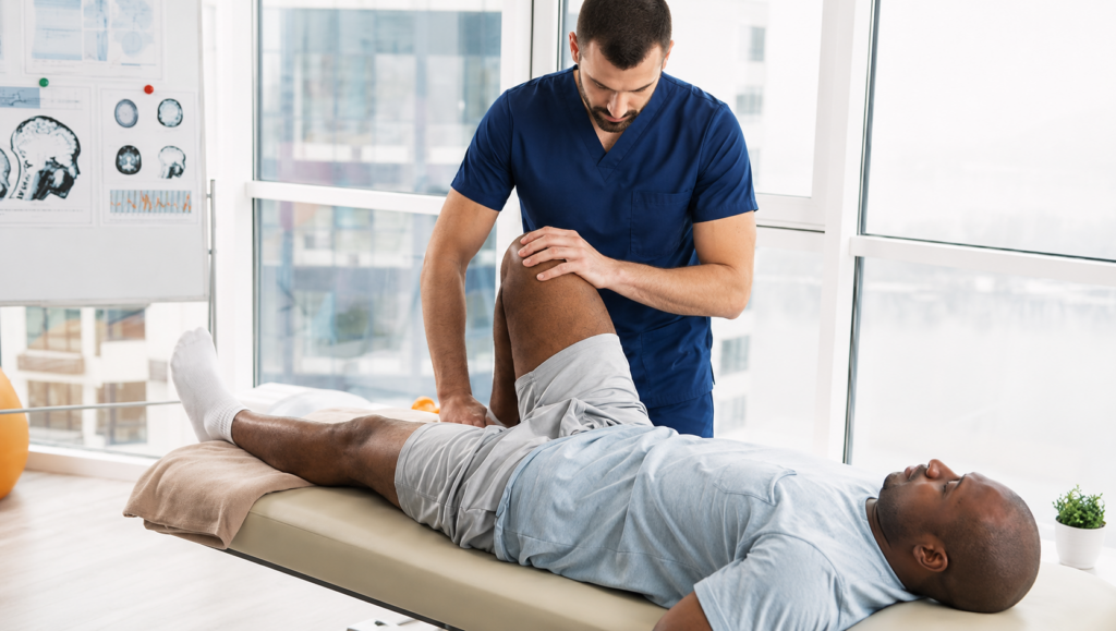 Satisfied with Chiropractic Care during personalized manual therapy to improve knee mobility and joint function.
